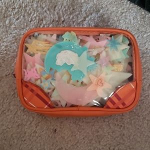 Container of glow-in-the- dark stars